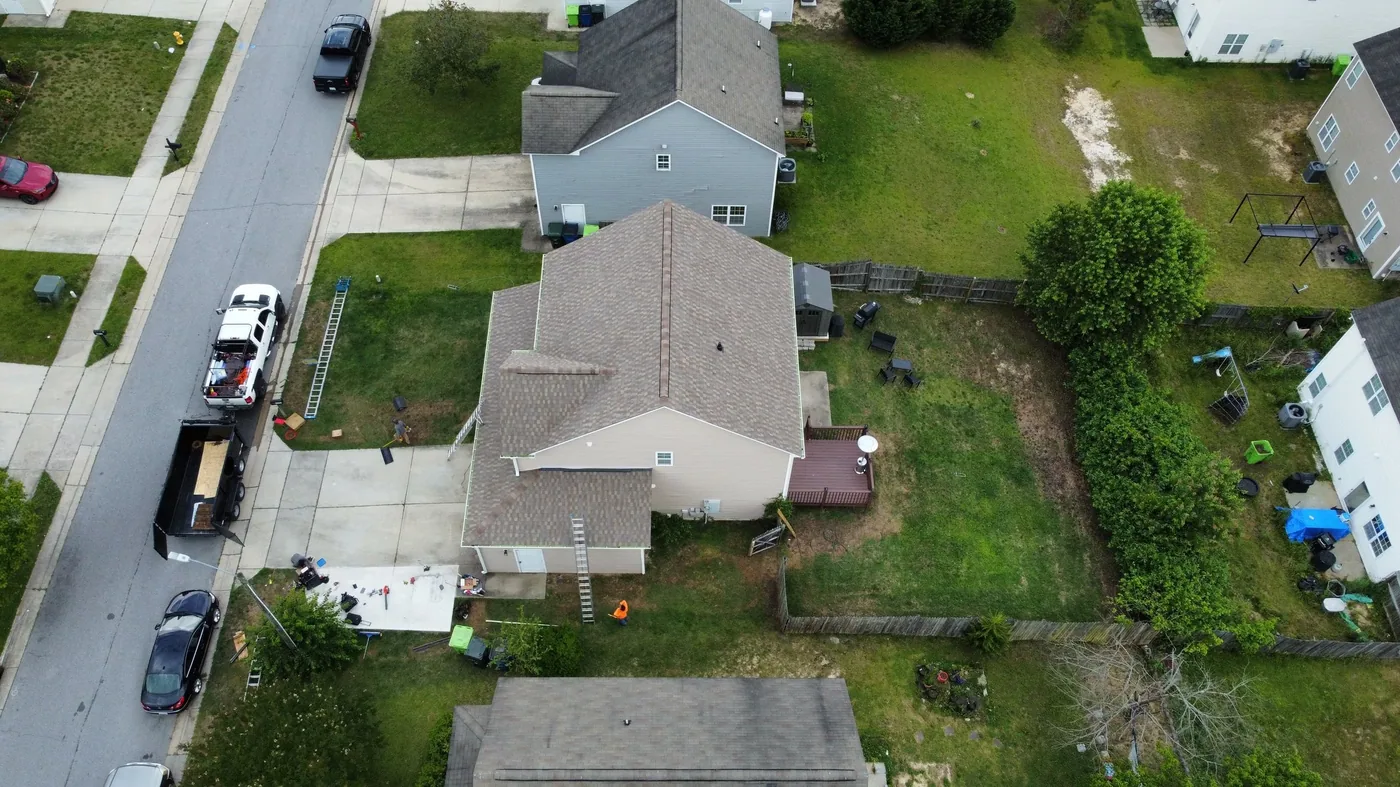 Home roofing specialists completing an install