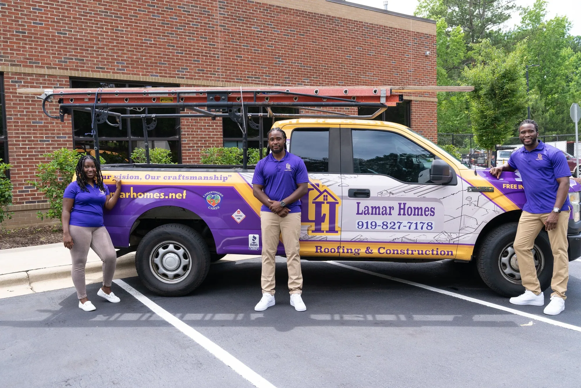 The Lamar Homes Roofing & Construction team standing beside their branded work truck in Raleigh, NC