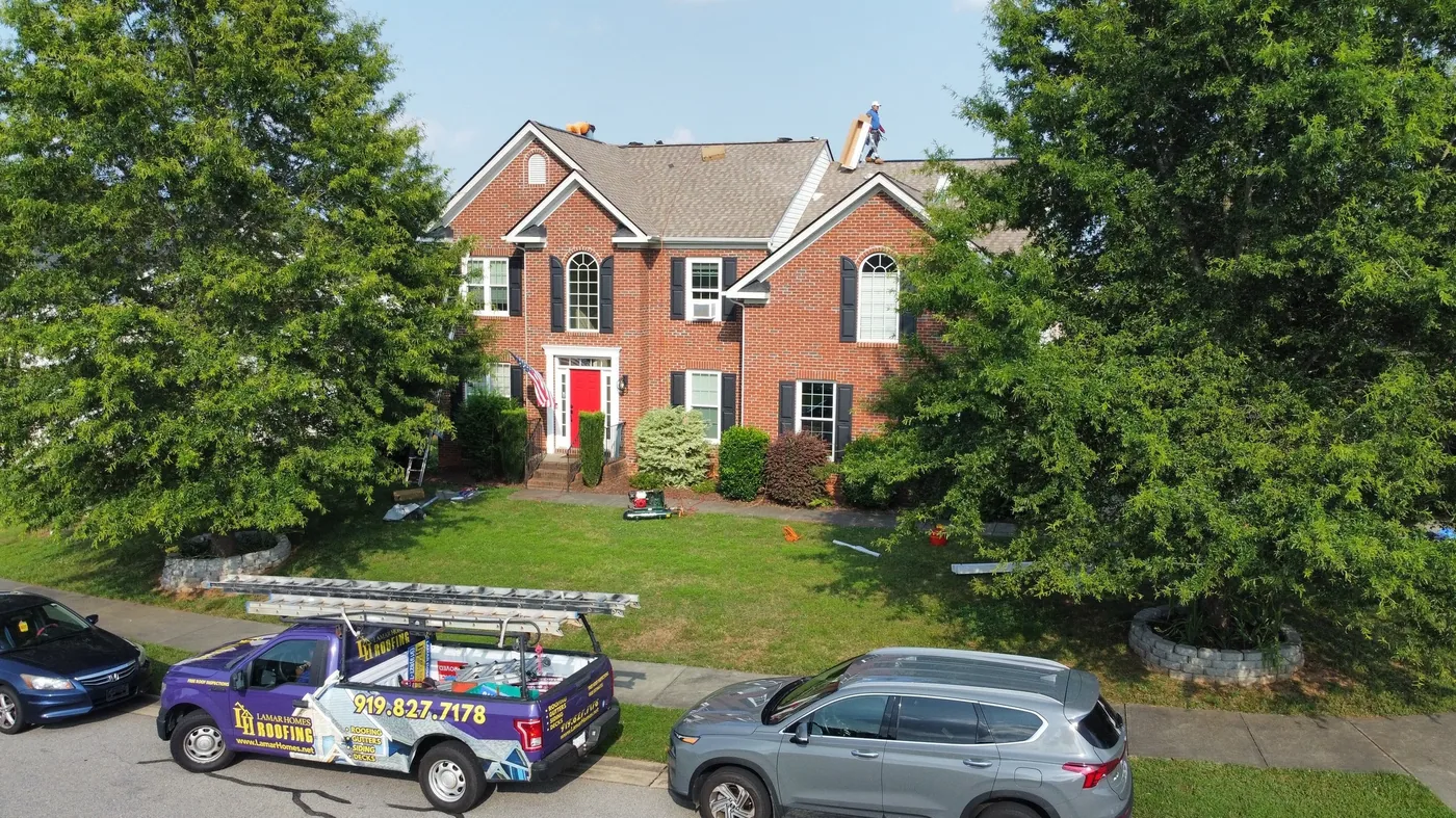 Lamar Homes team helping a Raleigh homeowner with a roof insurance claim
